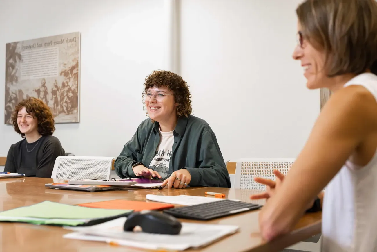 Sascha Scott reviews artwork for an upcoming show with her museum curation students at the SU Art Museum.